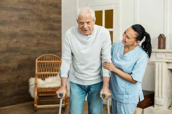 Nice aged man walking in the room — Stock Photo, Image