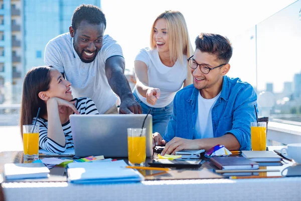 Positive colleagues beaming while working in team — Stock Photo, Image