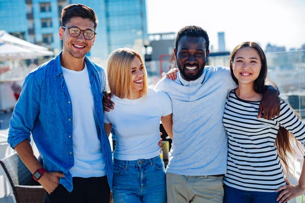 Waist up shot of international student on terrace — Stock Photo, Image