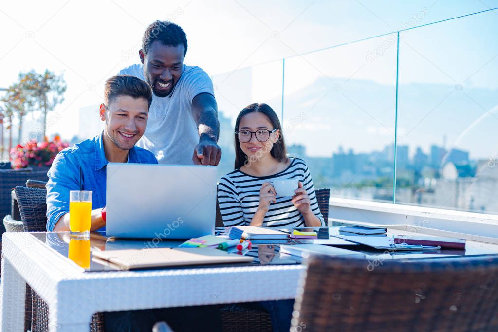 Group of international student studying outdoors