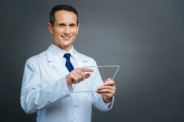 Cheerful man with invisible technological devise smiling — Stock Photo, Image