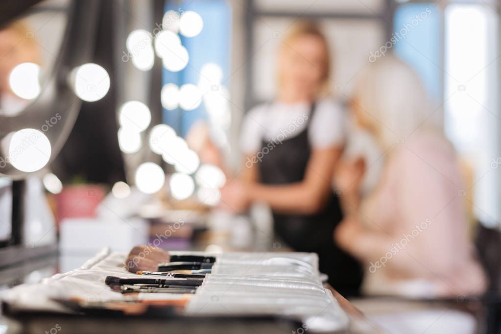 Professional makeup brushes set lying on the table