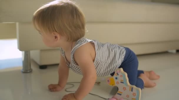 Lovely girl crawling on the floor — Stock Video