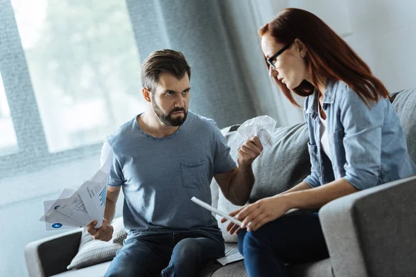 Cheerless brutal man looking at his girlfriend — Stock Photo, Image