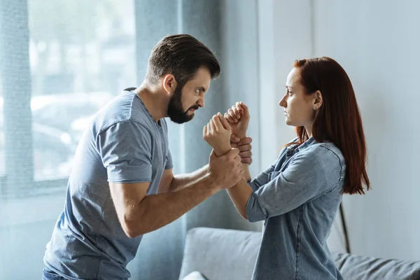 Angry strong man losing control over his emotions