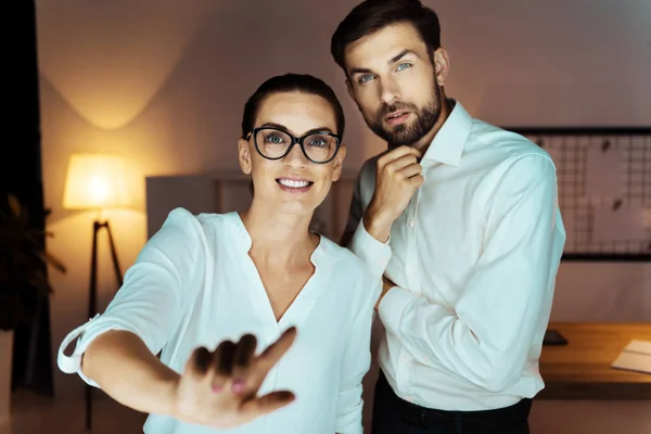 Amazing brunette standing near her partner — Stock Photo, Image