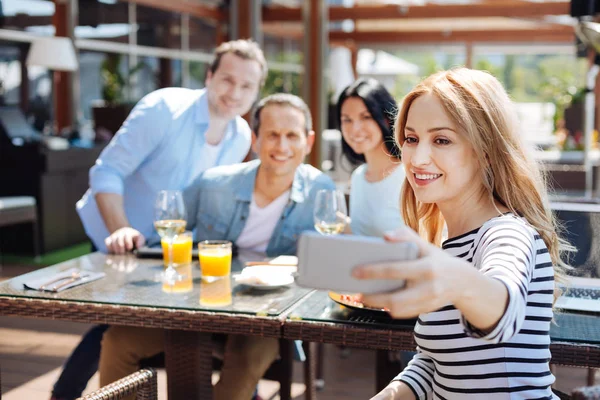 Beautiful young woman taking a selfie — Stock Photo, Image