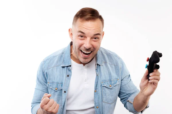 Overjoyed man being happy about victory in video game — Stock Photo, Image