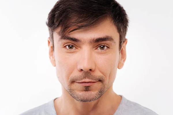 Close up of handsome black-haired bristled man — Stock Photo, Image