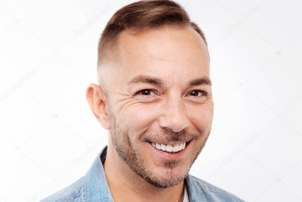 Portrait of smiling young man isolated on white background