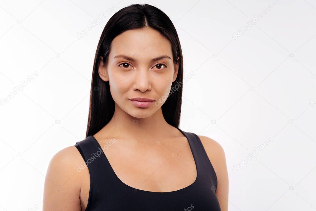 Portrait of attractive brunette woman posing on white background