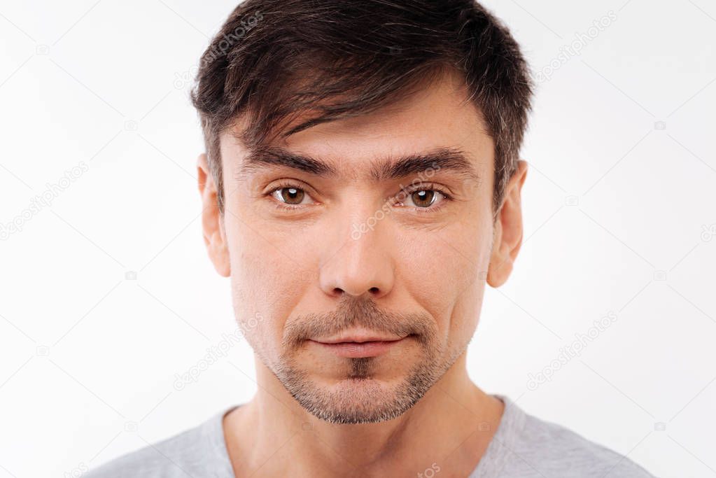Close up of handsome black-haired bristled man