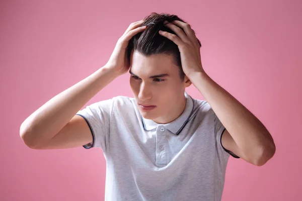 Worried boy putting both hands on his head — Stock Photo, Image