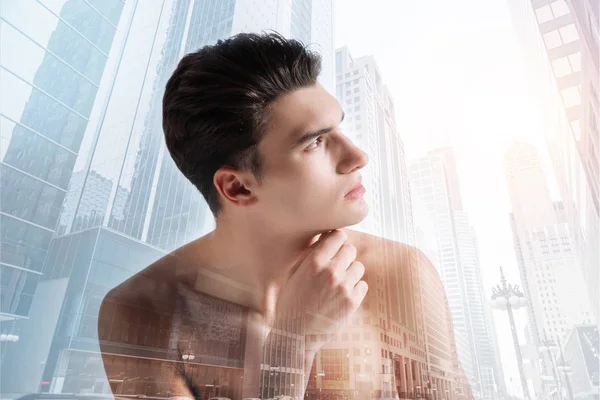 Handsome model being photographed in profile — Stock Photo, Image