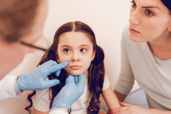 Serious longhaired kid visiting her therapist — Stock Photo, Image