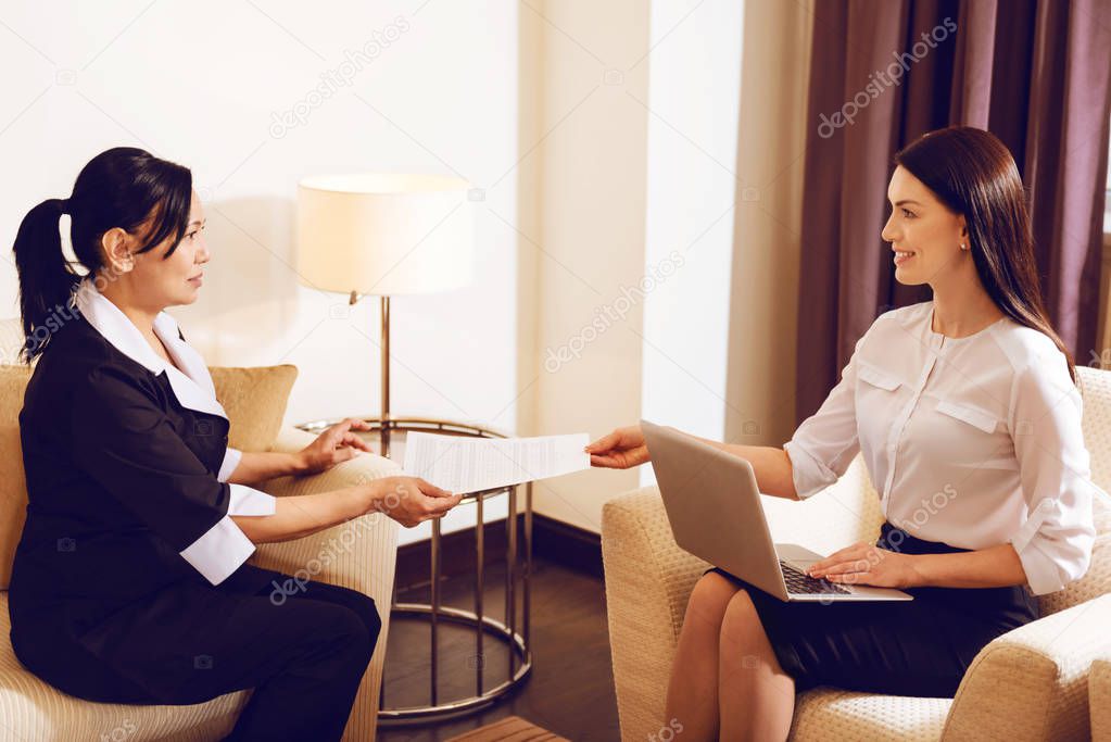 Delighted businesswoman having appointment with her helper