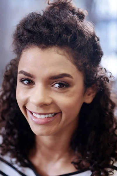 Nice content smiling curly-haired girl — Stock Photo, Image