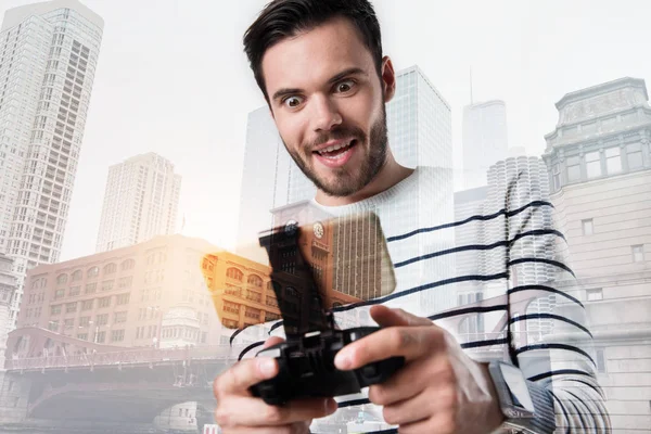 Excited happy man looking at the screen of his smart phone — Stock Photo, Image