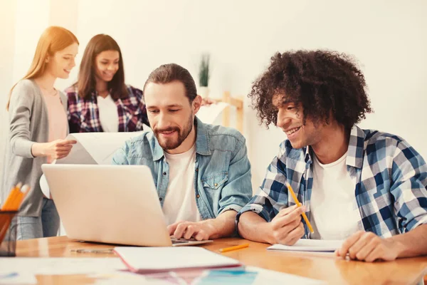 Young men involved in their research work — Stock Photo, Image