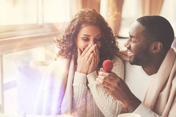 Cheerful handsome man proposing to his girlfriend — Stock Photo, Image