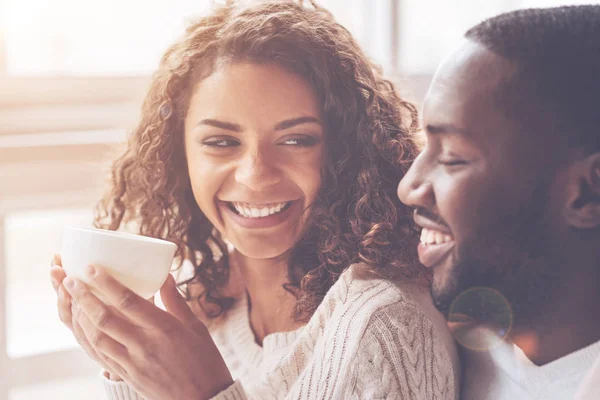 Beautiful female with curly hair looking at her man — Stock Photo, Image