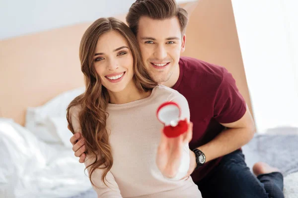 Beaming couple showing their proposal ring — Stock Photo, Image