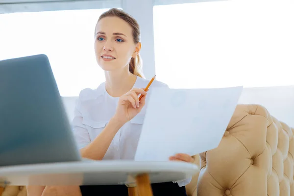 Kind smiling woman working with documents — Stock Photo, Image