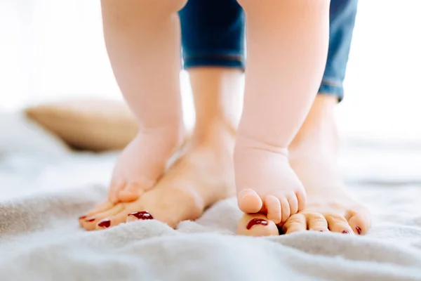 Cute little child attempting to take steps — Stock Photo, Image