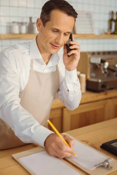 Delighted nice man talking on the phone — Stock Photo, Image