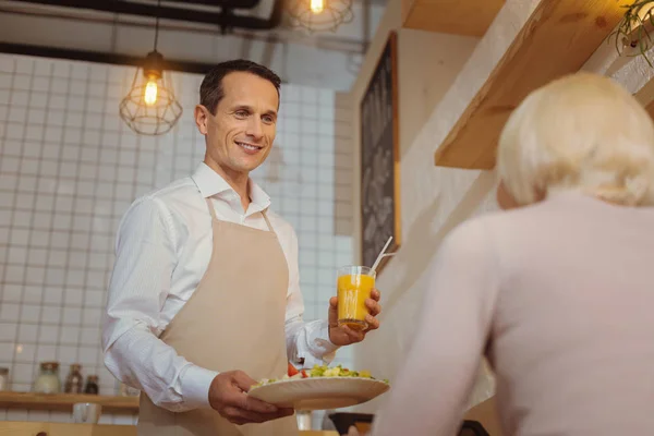 Handsome nice waited holding a breakfast — Stock Photo, Image