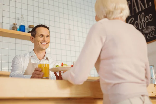 Happy friendly man giving the order — Stock Photo, Image