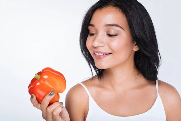 Woman holding a red bell pepper — Stock Photo, Image