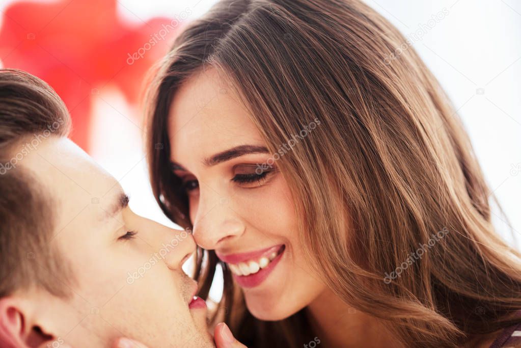 Close up of radiant couple kissing