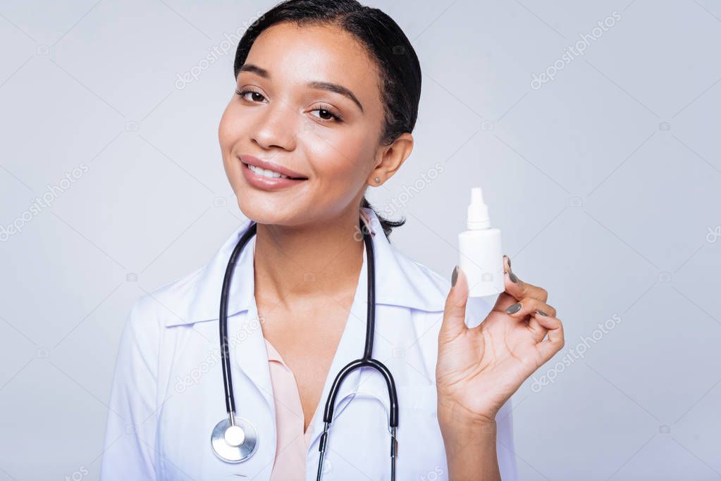 doctor posing with a nasal spray