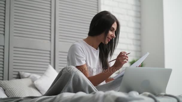 Positive young woman working at home — 图库视频影像