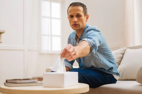 Crying sad man needs tissue — Stock Photo, Image