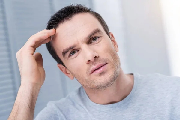 Disappointed frustrated man startling  with news — Stock Photo, Image