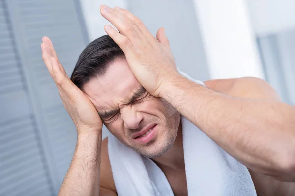 Painful uneasy man experiencing pain — Stock Photo, Image