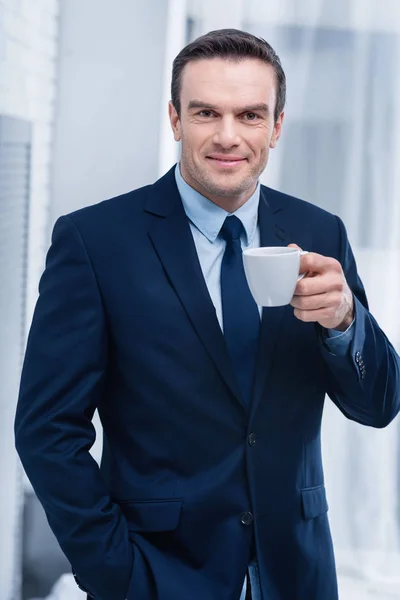 Energetic pretty man waking up with coffee — Stock Photo, Image