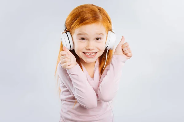 Delighted child smiling on camera — Stock Photo, Image