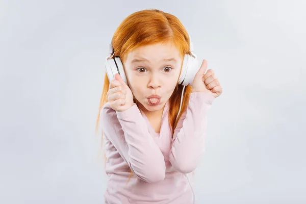 Funny girl showing her tongue — Stock Photo, Image