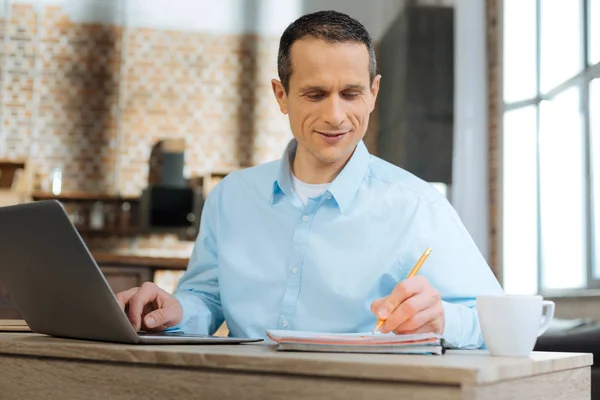 Concentrated male person doing his work — Stock Photo, Image