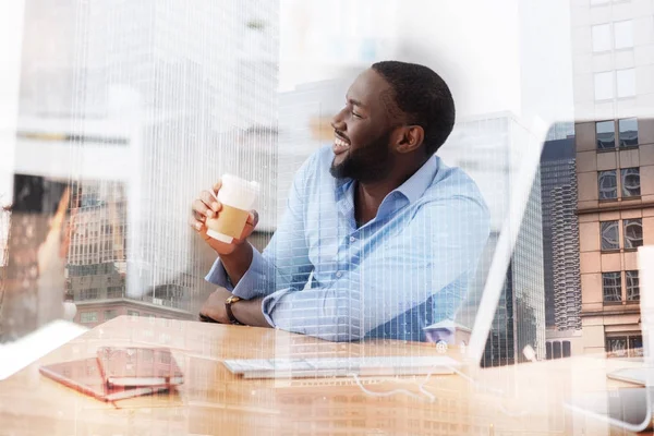 handsome worker drinking coffee