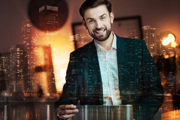 Young businessman sitting at the table — Stock Photo, Image