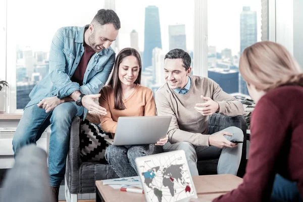 Clever smart employees using the laptop and working together. — Stock Photo, Image