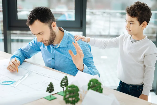 Busy architect having no time for his son — Stock Photo, Image