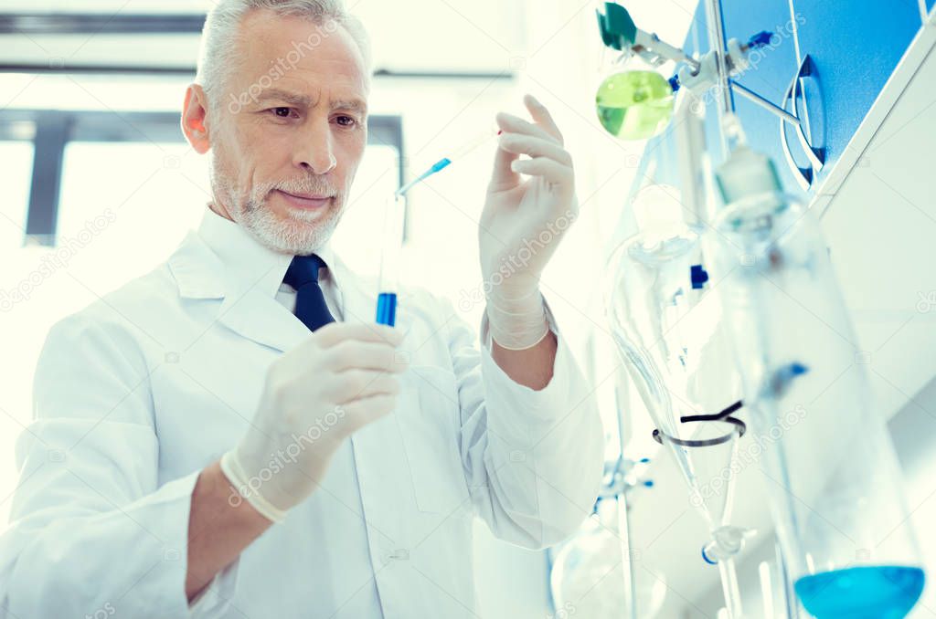 Cheerful lab worker working on chemical researcher