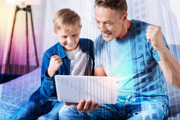 Pleased man spending time with his son — Stock Photo, Image