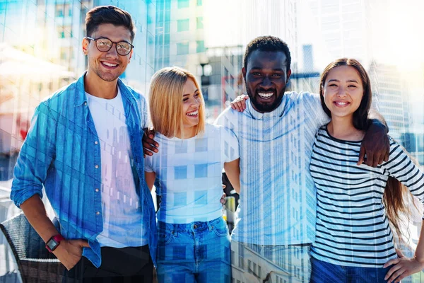 Alert colleagues smiling and standing together — Stock Photo, Image