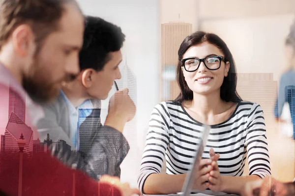 Cheerful beautiful woman having a meeting with her coleagues — Stock Photo, Image